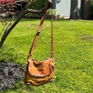 Fossil satchel. Multiple pockets. Leather and canvas material